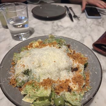 IDOL WOLF - Spanish Caesar is smothered in parmesan - Tapas/Small Plates Near Me - Saint Louis, Missouri