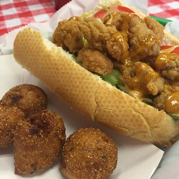 Crawfish Shack Seafood - Crawfish Poboy (1/2) with a side of hush puppies - Seafood Near Me - Atlanta, Georgia
