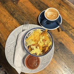 A breakfast bowl and cortado A breakfast bowl and cortado