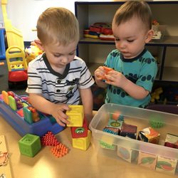 Grace Lutheran Childcare - Toddlers learning to play and share together.