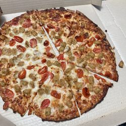 Pizza Hut - This is the "pesto pizza" they didn't give me pesto or cut it properly. Don't order after dark.
