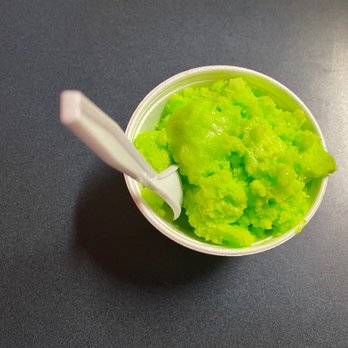 Don Lemus - a bowl of green food with a spoon in it - Mexican Near Me - Indianapolis, Indiana