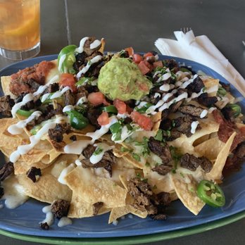 Cogburn's Big Wings - Nachos had to add meat - American Near Me - Gilbert, Arizona Cogburn's Big Wings - Nachos had to add meat - American Near Me - Gilbert, Arizona