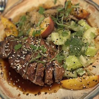 Jargon - Pork Loin with peaches, cabbage and cucumbers - New American Near Me - Asheville, North Carolina Jargon - Pork Loin with peaches, cabbage and cucumbers - New American Near Me - Asheville, North Carolina