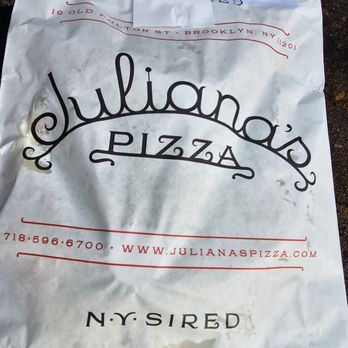 Juliana's - The pizzas come in paper 'sleeves' (on cardboard discs with tents to protect the top) versus your traditional cardboard pizza box - Pizza Near Me - Brooklyn, New York