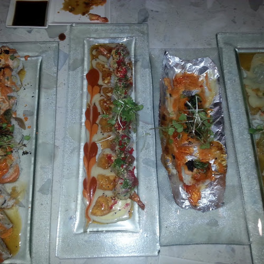Amici Sushi - If anyone thinks these portions aren't big enough... Perhaps a reevaluation of your intake needs to take place!  Amazing rolls! - Sushi Bars Near Me - Lathrop, California