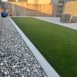 Turf, mow strip, concrete, and edge rocks Turf, mow strip, concrete, and edge rocks