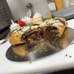 Get Jerked - This is a succulent jerk, chicken pizza puff made homemade in-house