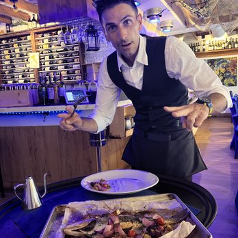 La Pescheria - Franchesco bringing out zee Branzino Fish - Seafood Near Me - Naples, Florida La Pescheria - Franchesco bringing out zee Branzino Fish - Seafood Near Me - Naples, Florida