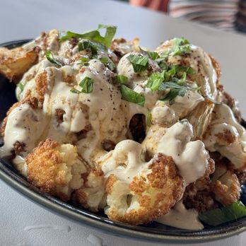 Ayat - Zahir - fried cauliflower served on a tahini bed topped with olive oil & drizzled with pomegranate molasses - Desserts Near Me - Allentown, Pennsylvania Ayat - Zahir - fried cauliflower served on a tahini bed topped with olive oil & drizzled with pomegranate molasses - Desserts Near Me - Allentown, Pennsylvania