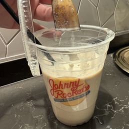 Spiked banana shake with banana peel in it. Spiked banana shake with banana peel in it.