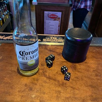 Bottom's Up South - a bottle of liquor and dice - Bars Near Me - South Milwaukee, Wisconsin