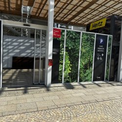 Hertz - The entrance to the Hertz car rental office.  Go inside and take the elevator/lift or stairs down one level