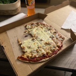 a pizza in a cardboard box a pizza in a cardboard box