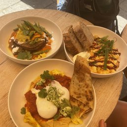 Poached egg masala, kimchi scramble, chickpea flatbread
