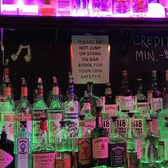 Sing Sing Ave.A - bottles of liquor on a bar shelf - Karaoke Near Me - New York, New York Sing Sing Ave.A - bottles of liquor on a bar shelf - Karaoke Near Me - New York, New York