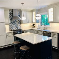 M&M Construction and Restoration - Island and cabinets with LED strip lights underneath and in the cabinet