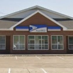 U S Government - View of front of US Postal Service building and main parking lot in Newport, Arkansas