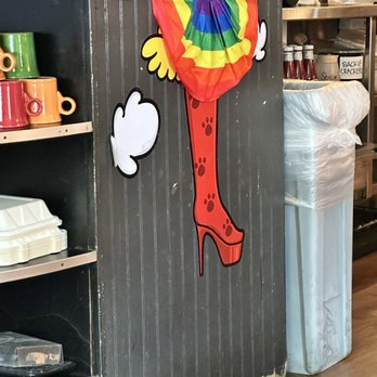 Barnaby's Cafe - a woman's boot hanging on a wall - American Near Me - Houston, Texas