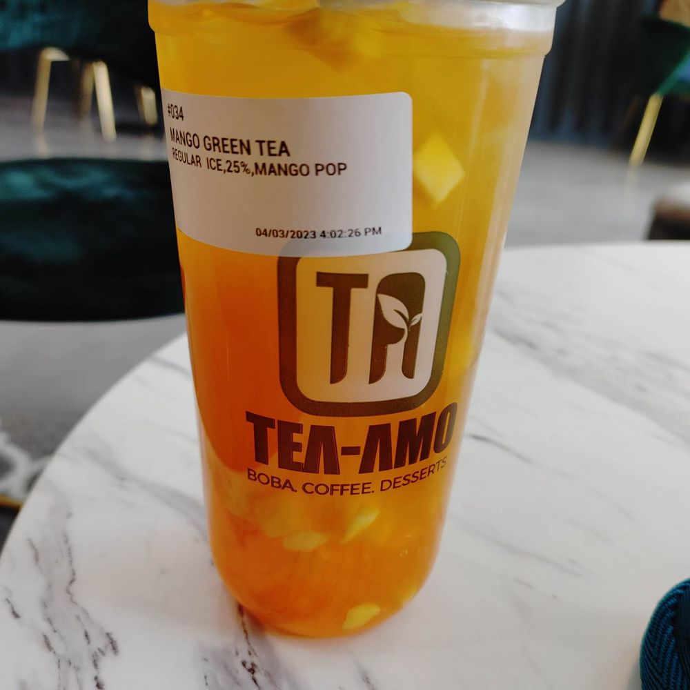 Mango Green Tea with Mango Popping Boba Mango Green Tea with Mango Popping Boba