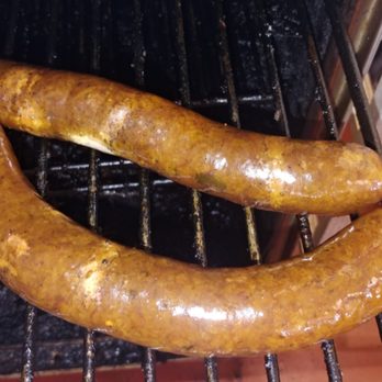 Butcher's Meats - two sausages cooking on a grill - Meat Shops Near Me - Wichita Falls, Texas Butcher's Meats - two sausages cooking on a grill - Meat Shops Near Me - Wichita Falls, Texas