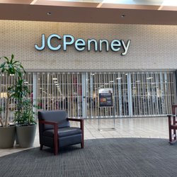JCPenney - JC PENNY @ Parkdale Mall - past 10am and doors still locked while 3-4 employees in left side folding shirts.