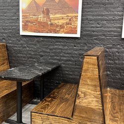 Yemeni Restaurant & Shawarma Mediterranean - Interior seating booths and a lovely portrait of Giza, Cairo, Egypt.