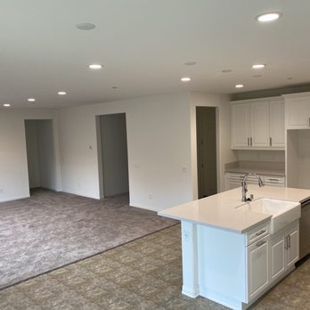 ADS Flooring Co - a woman standing in a kitchen - Flooring Near Me - Riverside, California