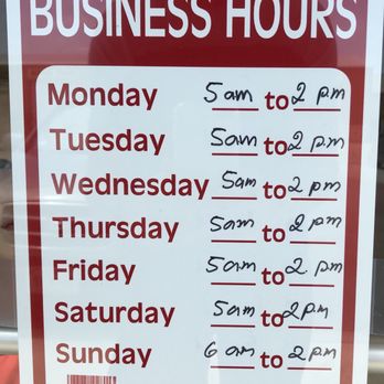 Fresh Donuts - a business hours sign in a window - Donuts Near Me - Buda, Texas