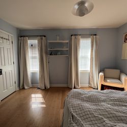 James & Odessa Flooring - Guest bedroom with bamboo flooring.