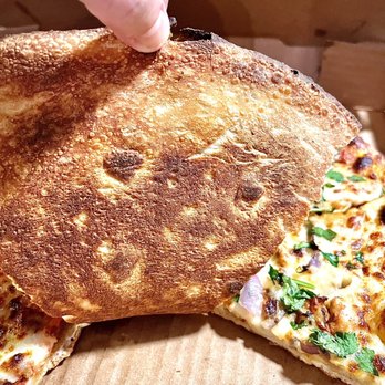Alanos Pizza & Subs - Bottom of  Butter Chicken pizza. - Pizza Near Me - Dearborn, Michigan