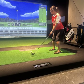 X-Golf - She was getting the feel of the game - Venues & Event Spaces Near Me - Gainesville, Florida X-Golf - She was getting the feel of the game - Venues & Event Spaces Near Me - Gainesville, Florida