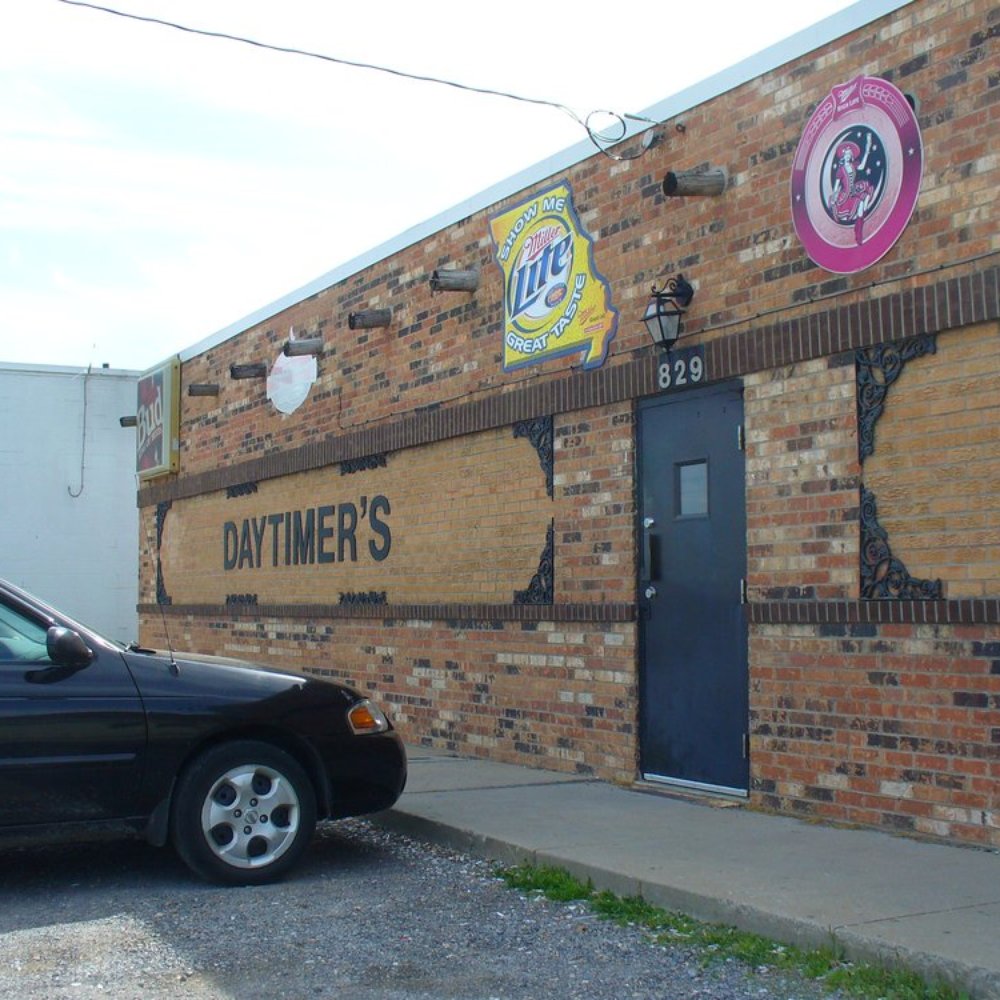 Daytimer Lounge - a car parked in front of a brick building - Dive Bars Near Me - Cape Girardeau, Missouri