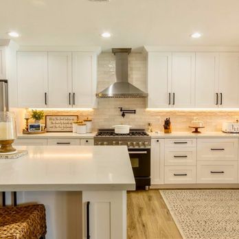 Coast Design & Build - a kitchen with white cabinets and a large island - Solar Installation Near Me - San Diego, California Coast Design & Build - a kitchen with white cabinets and a large island - Solar Installation Near Me - San Diego, California