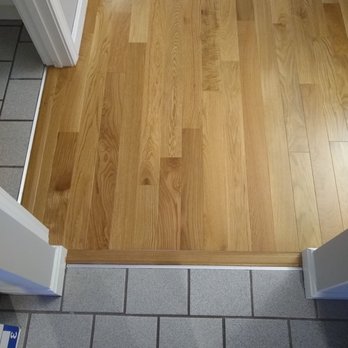 The Flooring Source - Transition where new oak floors meet kitchen. Other installers seemed to think it'd be a problem but The Flooring Source did it perfectly. - Flooring Near Me - Middleton, Massachusetts