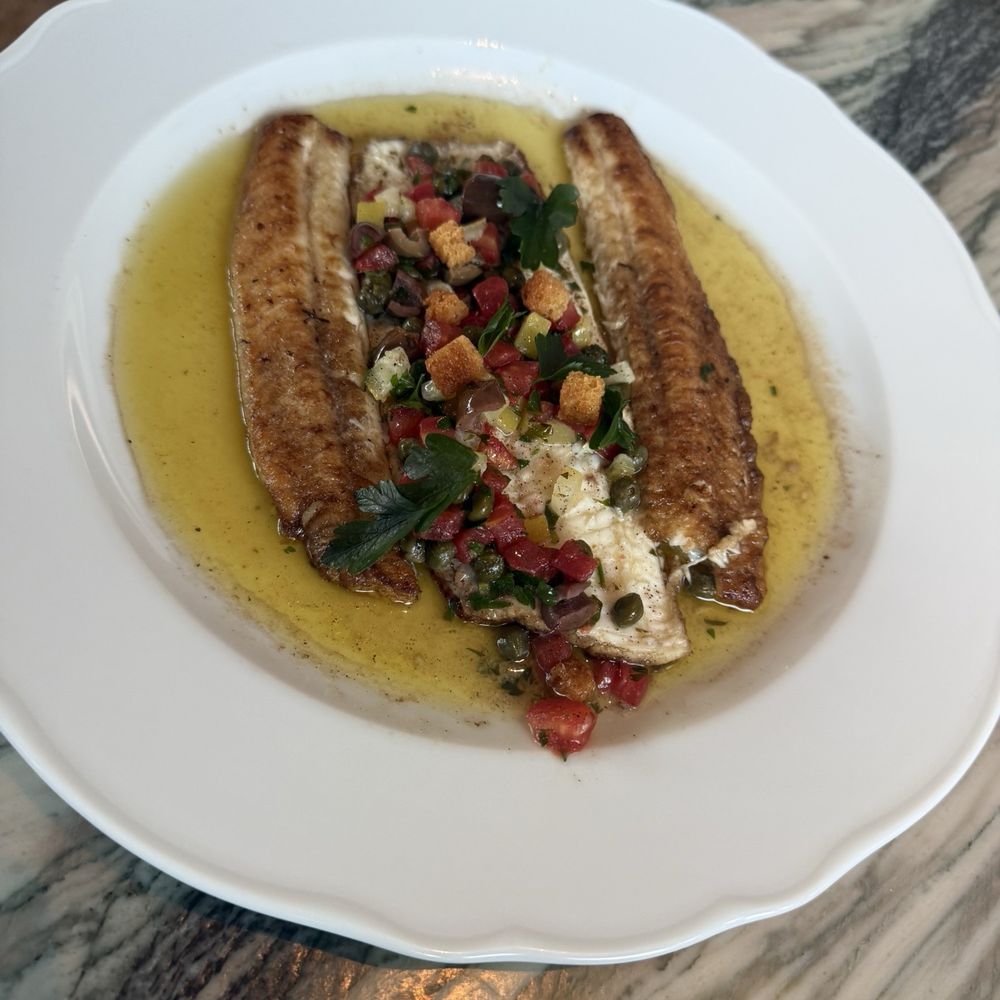 Soggy Sole in a sea of butter with croutons and tomatoes