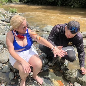 Carabali Rainforest Park - Our tour guide painting my mom with rocks . - Horseback Riding Near Me - Luquillo, Puerto Rico