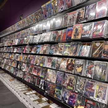Knowhere Games & Comics - Large wall of current titles. - Tabletop Games Near Me - San Marcos, California