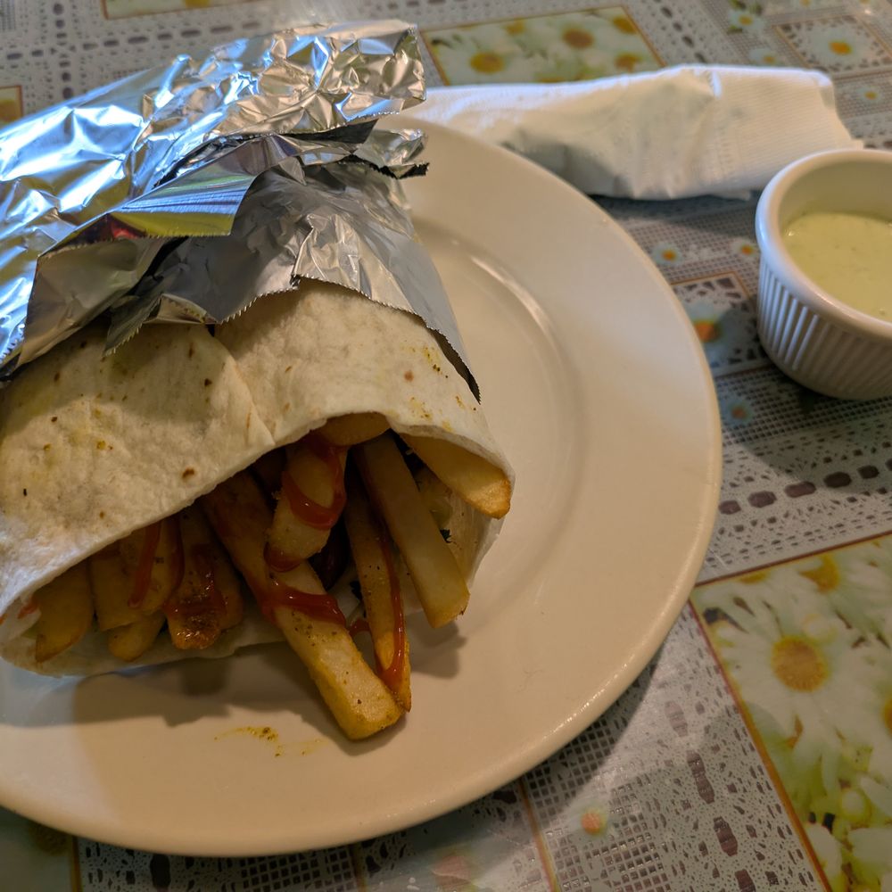 Afghan Darbar Restaurant - Afghan hamburger: fries, spicy ketchup, vegetables, sausages, and hard boiled eggs in a wrap. Served with chutney. - Afghan Near Me - Bloomington, Minnesota