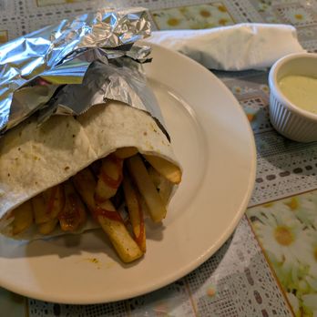 Afghan Darbar Restaurant - Afghan hamburger: fries, spicy ketchup, vegetables, sausages, and hard boiled eggs in a wrap. Served with chutney. - Afghan Near Me - Bloomington, Minnesota Afghan Darbar Restaurant - Afghan hamburger: fries, spicy ketchup, vegetables, sausages, and hard boiled eggs in a wrap. Served with chutney. - Afghan Near Me - Bloomington, Minnesota