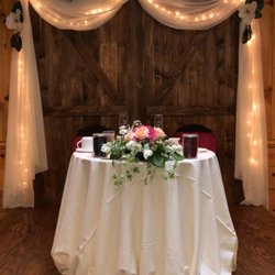 Alpine Grove Banquet Facility - Skylight room- sweetheart table with our Barn door backdrop.