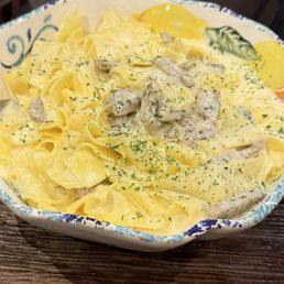 Wow, what a large bowl of fettuccine Alfredo w/ Italian sausage for the protein.
