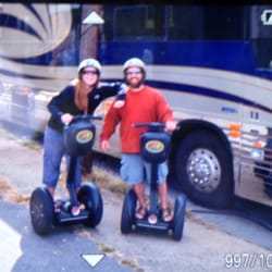 Moving Sidewalk Tours - My husband and I in front of Ani Difranco's tour bus outside of The Orange Peel (image from camera viewfinder)