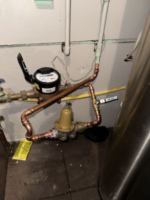 Junior’s Progressive Plumbing & Repairs Logo