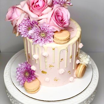Cakes By Sabah - a cake decorated with flowers and macaroons - Custom Cakes Near Me Cakes By Sabah - a cake decorated with flowers and macaroons - Custom Cakes Near Me