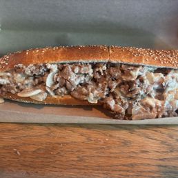 Cheesesteak. Lots of cheese, meat, and unfortunately, onions.
