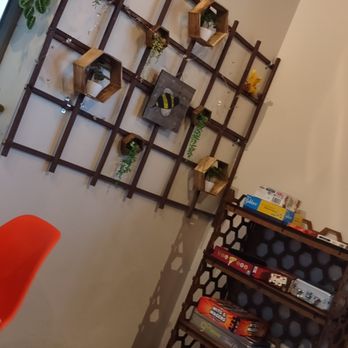 The Rusty Bumblebee - Kmick knack wall behind host stand & game shelves - Beer Bar Near Me - Blaine, Minnesota