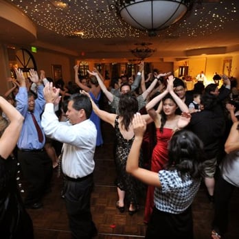 Groove Box Entertainment - a group of people dancing at a party - DJs Near Me - Anaheim, California Groove Box Entertainment - a group of people dancing at a party - DJs Near Me - Anaheim, California