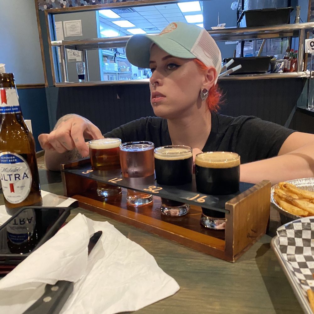 Spliff's Gastropub - Cool manager telling us about the flight of beers we ordered. About $3 bucks each beer. It's cool you get to try different beers. - Beverage Store Near Me - Jacksonville, Florida