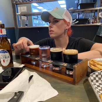 Spliff's Gastropub - Cool manager telling us about the flight of beers we ordered. About $3 bucks each beer. It's cool you get to try different beers. - Beverage Store Near Me - Jacksonville, Florida